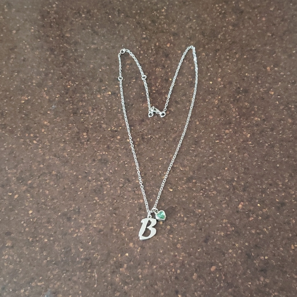 Elegant Silvertone Necklace with Green Heart Gemstone.
